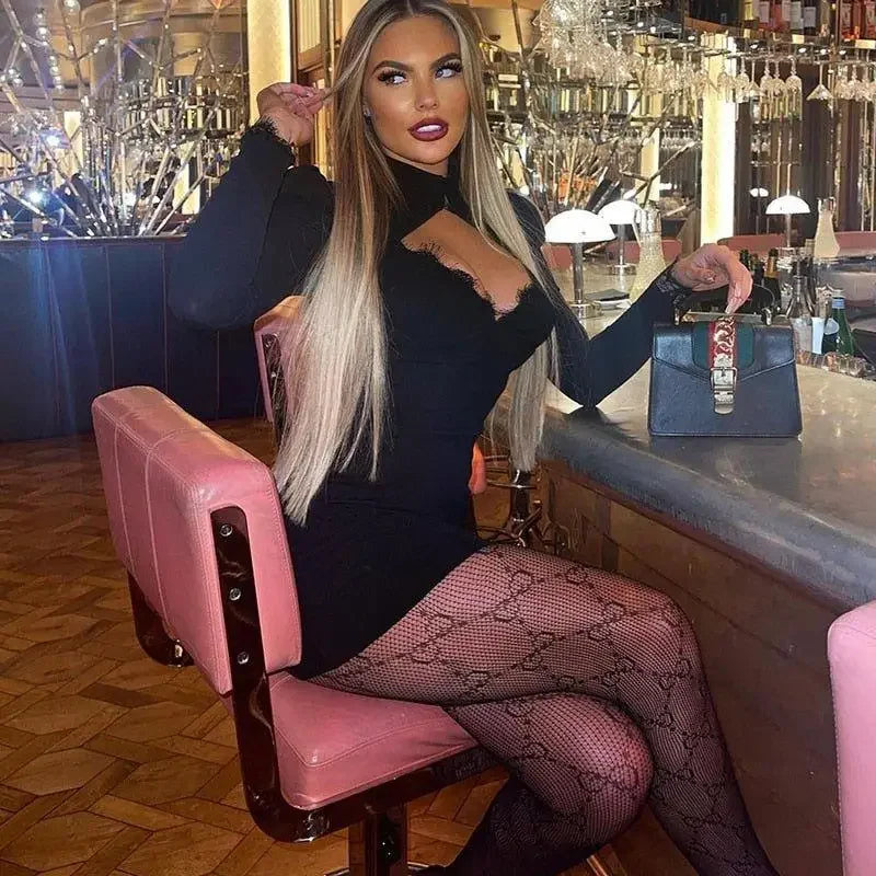 Woman in black dress and patterned tights wearing an elegant spring dress