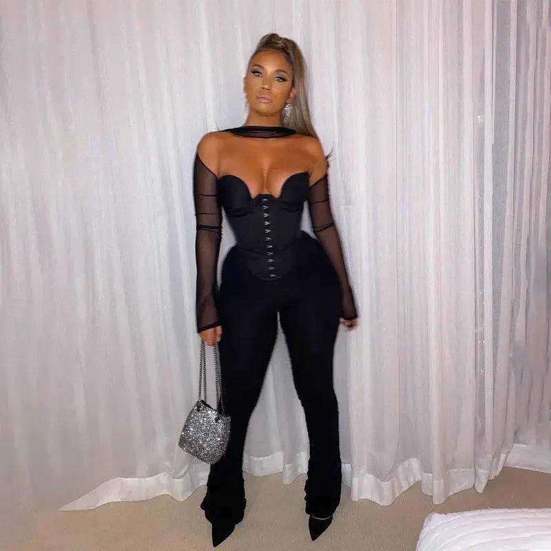 Woman in black corset crop top jumpsuit from online boutique women’s fashion collection
