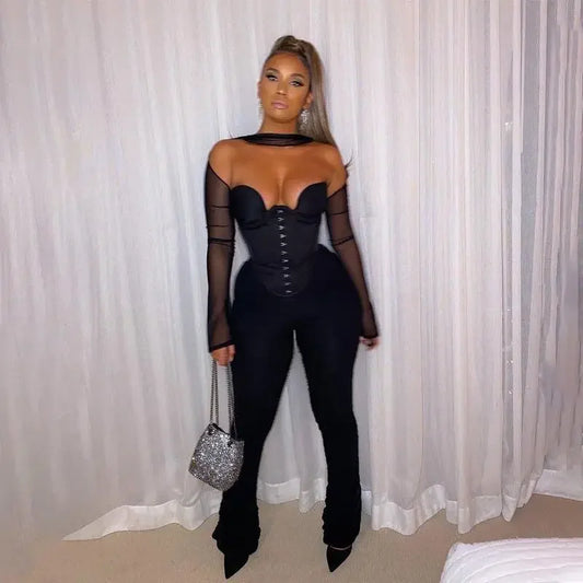 Woman in black corset crop top jumpsuit from online boutique women’s fashion collection
