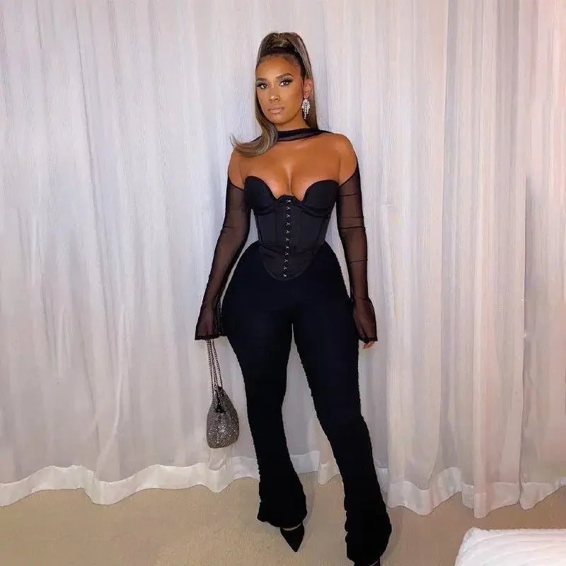 Woman in black corset crop top and pants from online boutique women’s fashion collection