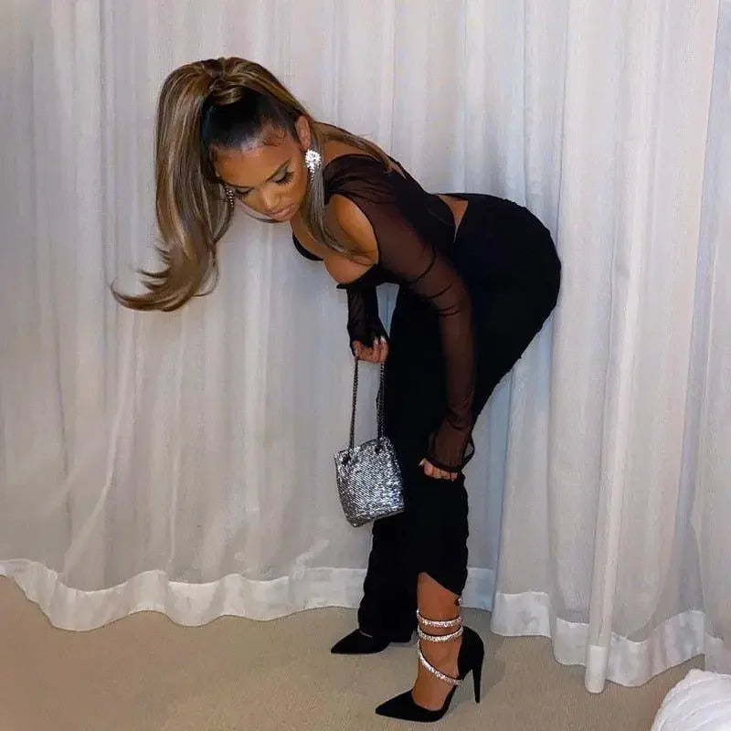 Woman in black outfit with silver purse modeling Corset Crop Top at online boutique