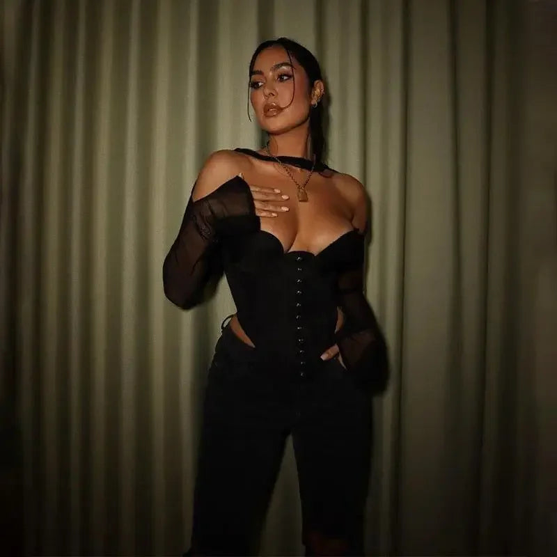 Elegant woman wearing a black corset crop top from our online boutique in women’s fashion