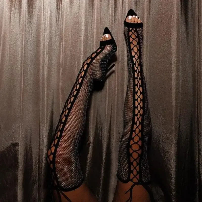 Sparkly fishnet thigh-high heels with crystal cross tied design on Over-The-Knee Cross Tied Boots