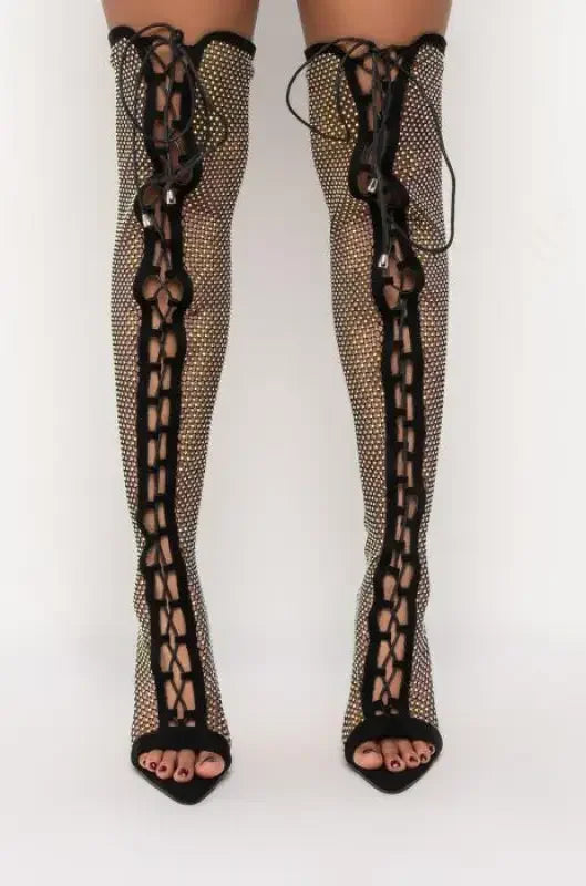 Rhinestone-studded lace-up thigh-high boots highlighted in Over-The-Knee Crystal Cross Tied Boots
