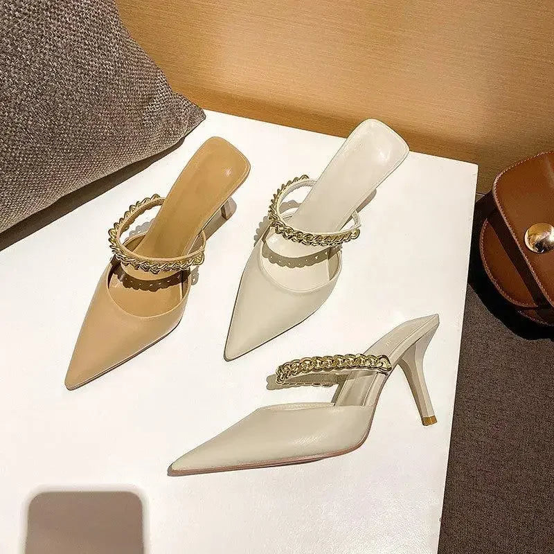 Elegant pointed toe heels with chain straps, perfect for stylish occasions