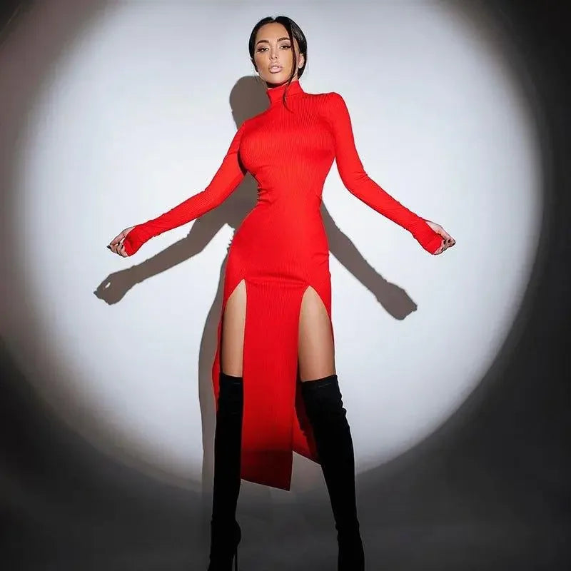 Woman in a red slit stretchy elegant dress with thigh-high boots showcasing style