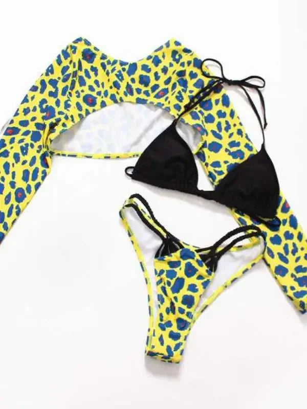 Yellow and blue leopard print beach resort bikini with black top and cover-up at Leopard Beach Resort