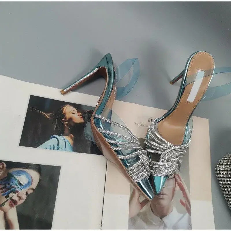 Shiny pointed toe crystal transparent pumps with jeweled details and high heels