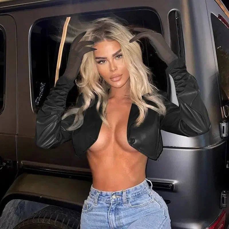 Blonde woman modeling the stylish leather irregular crop jacket for trendy fashion