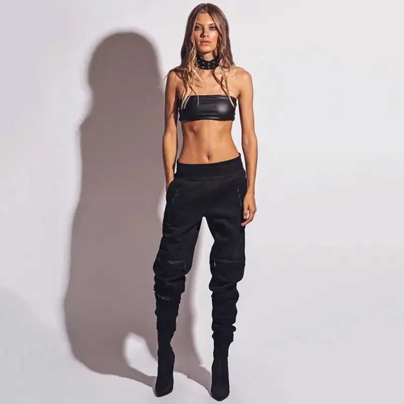 Woman in black tube top and casual fitness pants showcasing stylish fitness pants attire