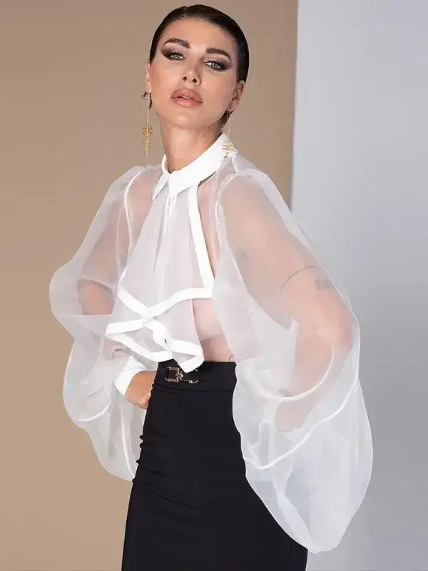 Woman wearing Ruffles Turndown Collar Loose Bodysuit with sheer white blouse and black skirt