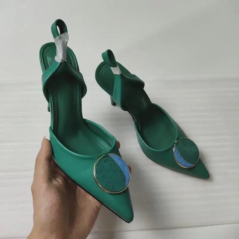 Green slingback heels with circular embellishments showcasing the new Design Pointed Toe style