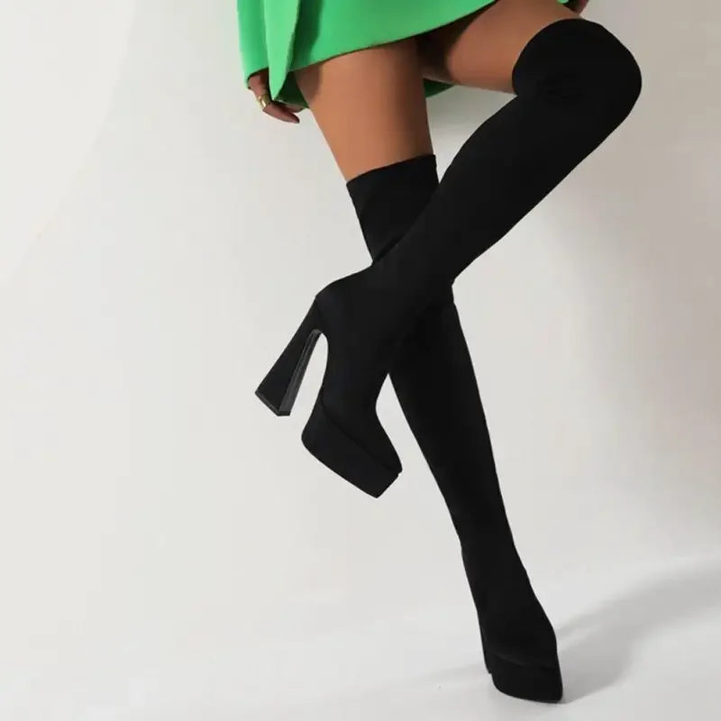 Black thigh-high platform sock boots featuring knee platform sock design