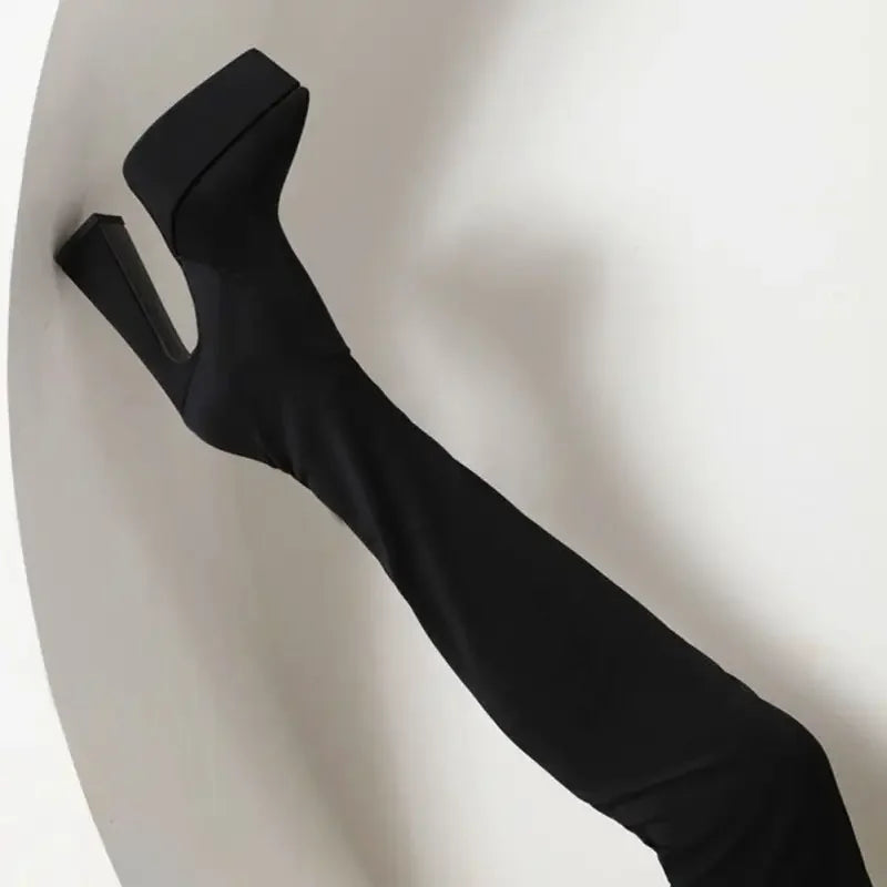 Black platform thigh-high sock boots featuring a sleek knee platform sock design