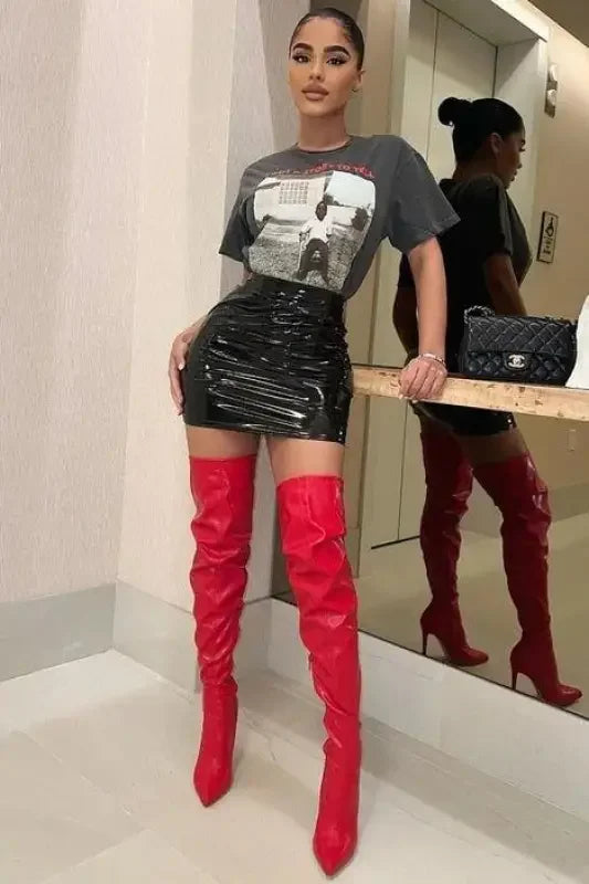 Woman in red thigh-high knee boots from New Over The Knee Boots collection at an online boutique