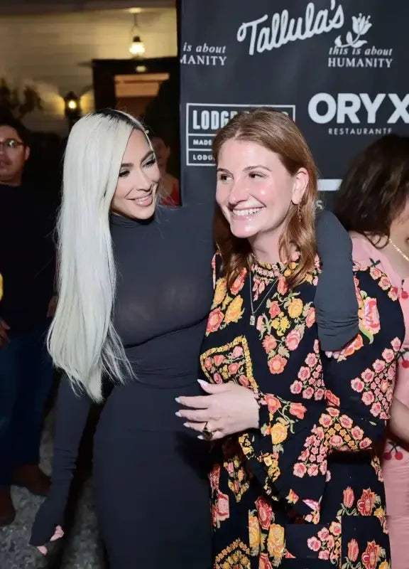 Two women posing in Kim Kardashian’s long-sleeved dress from an online boutique women’s fashion