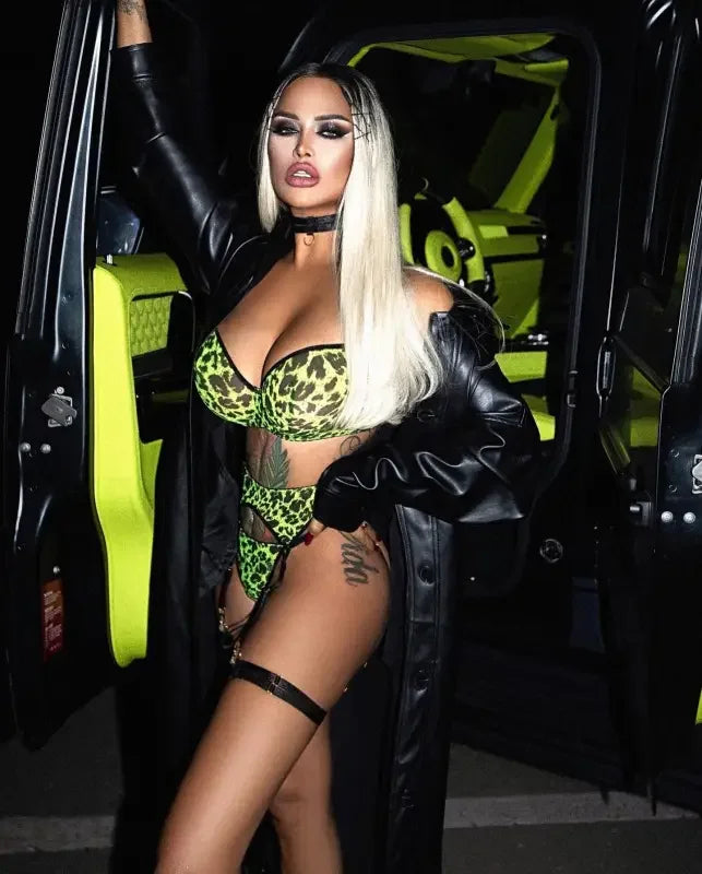 Woman in leopard lingerie 3-piece transparent garter set with leather coat for elegant style