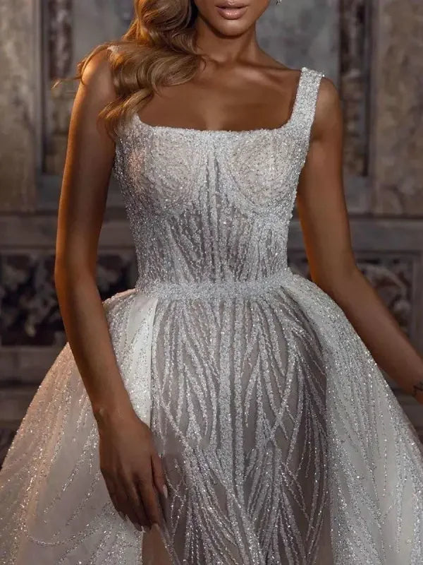 Sparkly wedding dress with square neckline and detachable train perfect for a sparkling wedding
