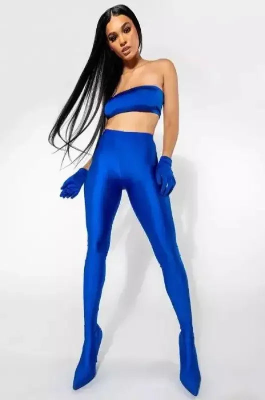 Woman wearing blue tube top and leggings showcasing Stiletto Pant Boots styled with pant boots