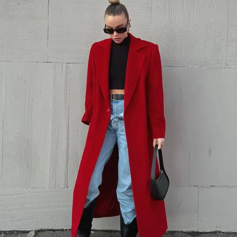 Woman in a long dark red woolen women coat showcasing elegant winter fashion