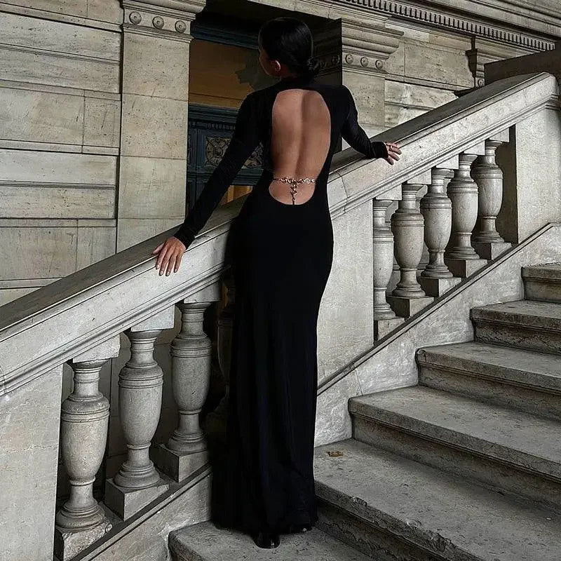 Backless black gown in a long sleeve maxi dress perfect for autumn occasions