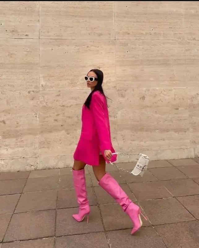 Woman in pink blazer dress showcasing stylish Pink Pointed Toe Knee High Boots