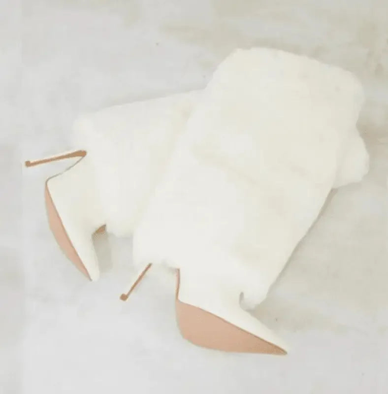 White fur-trimmed fur knee high boots from Winter Fur for online boutique shopping