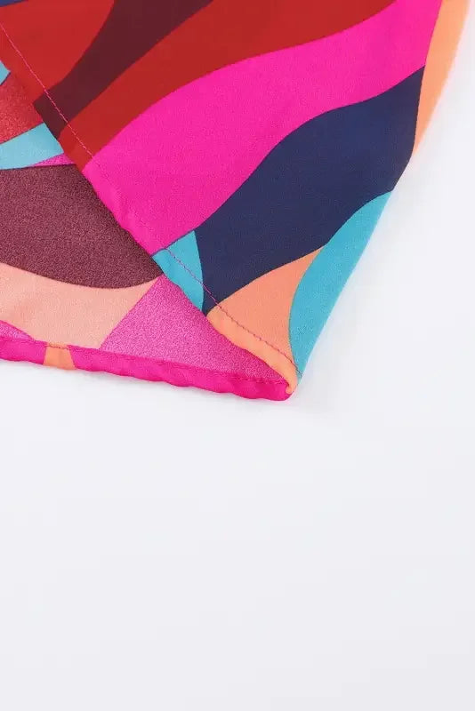 Colorful patterned fabric for belted puff sleeve mini dress with red abstract printed design