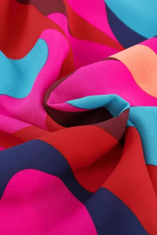 Belted puff sleeve mini dress featuring wrinkled red abstract printed colorful fabric