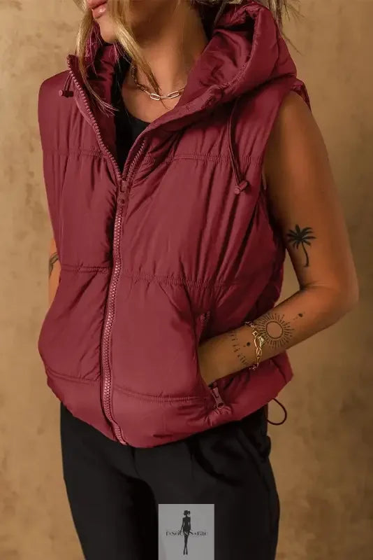 Burgundy hooded puffer vest with side pockets for a stylish and warm look