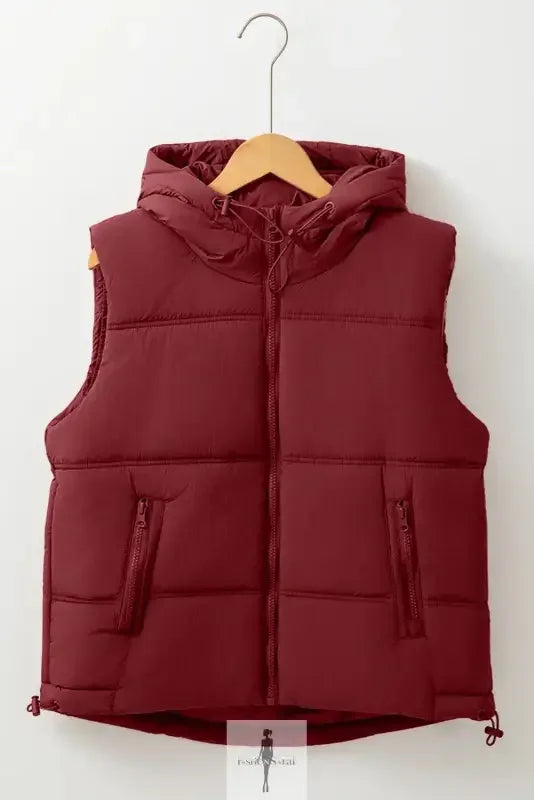 Maroon hooded puffer vest with zip-up pockets and side pockets for added style