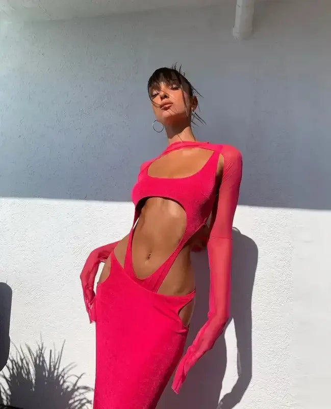 Woman in a revealing pink dress, showcasing the Rose Mesh Sexy Bodycon Dress with stripe bodysuit details