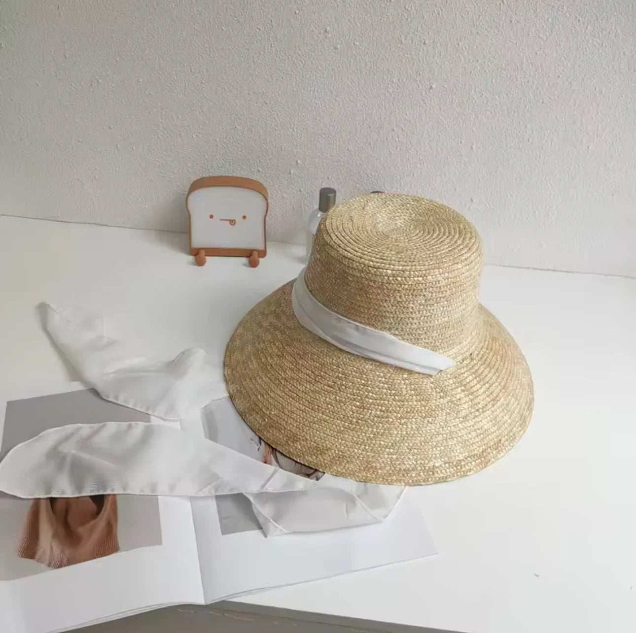 Navy band straw ladies hat with wide brim and solid pattern for women